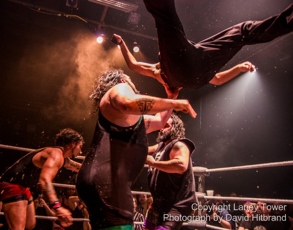 The Stoner Brothers, Rick Scott and Scott Rick, toss Jonny “Drinko” Butabi high in the air to set him up for a “Rizz Bomb,” their finishing move.